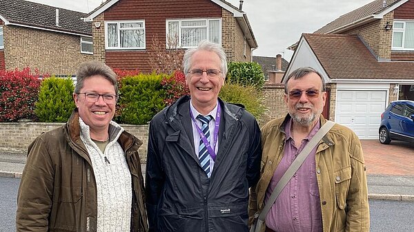 Councillors David, Marcus and Richard stood in a street