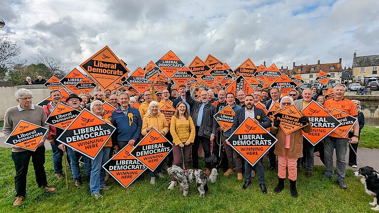 Vikki stood with a crowd of Lib Dem volunteers